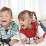 Kids playing video games at sleepover